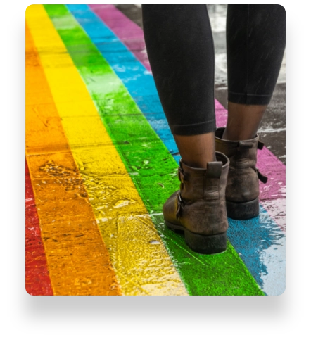 Brown boots on a rainbow floor